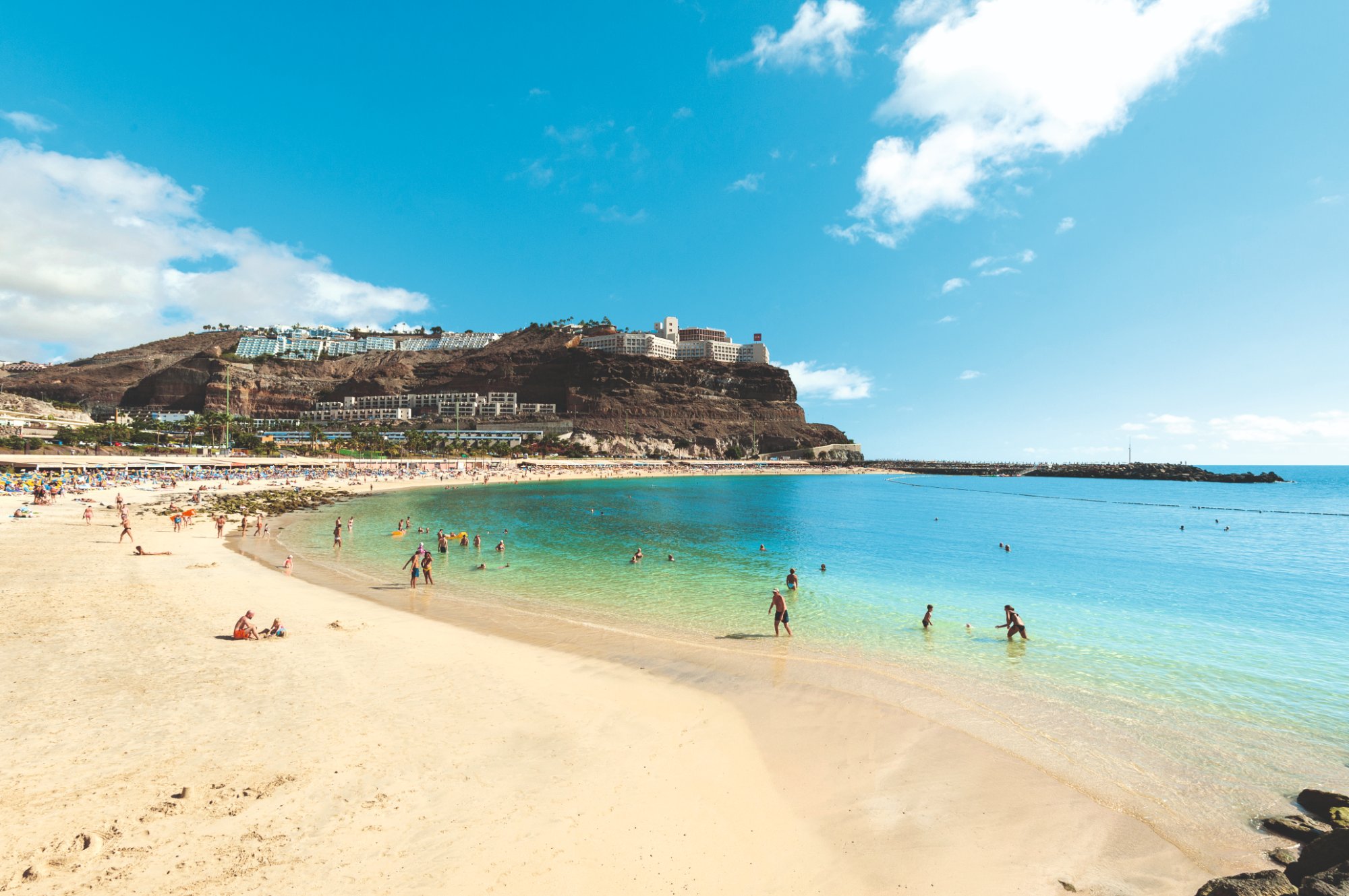 Golden sand and turquoise water at Amadores beach