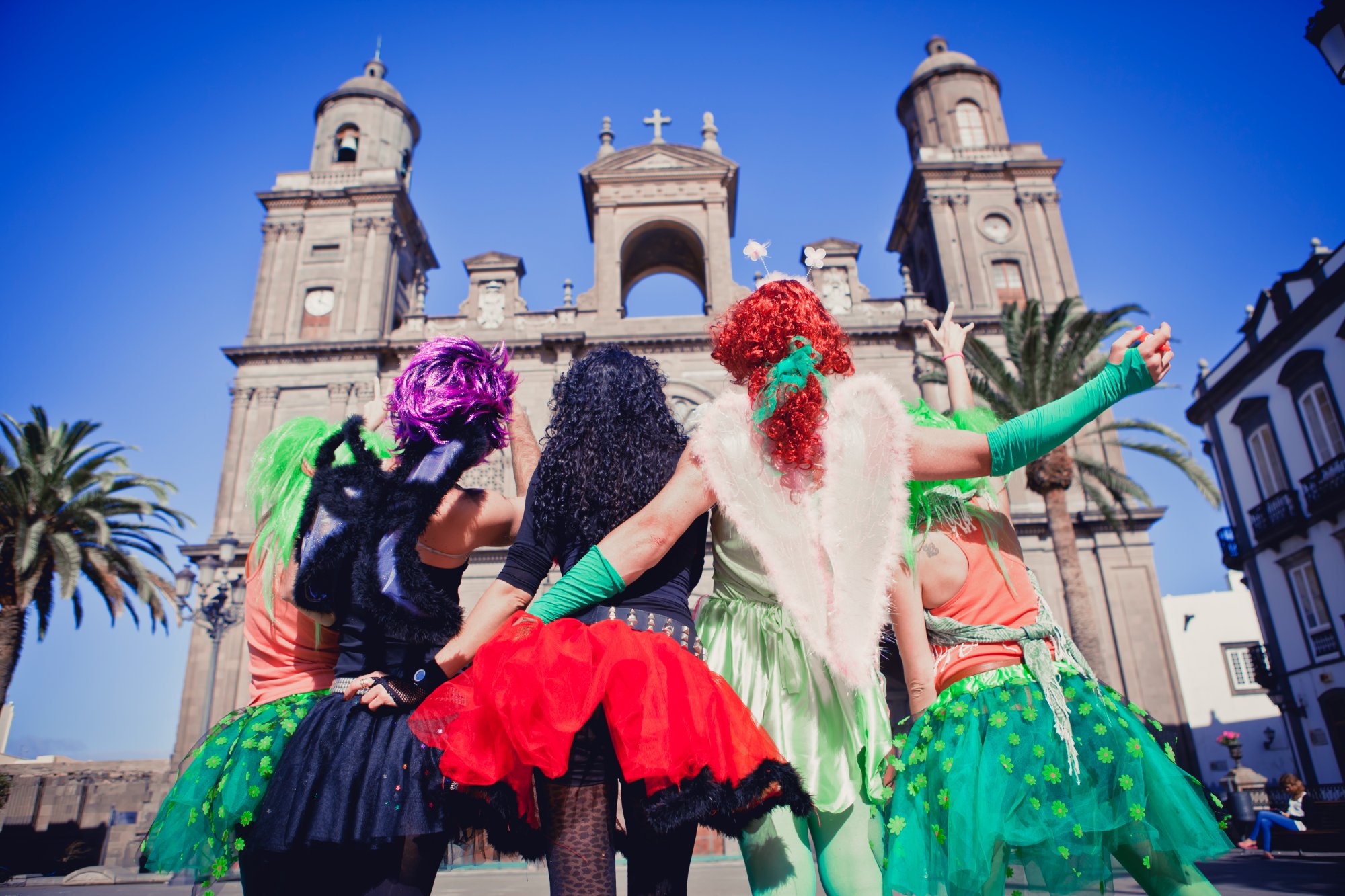 Carnival revellers in costume outside Santa Ana Cathedral