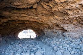 Natural volcanic cave formation with light streaming through in Gran Canaria