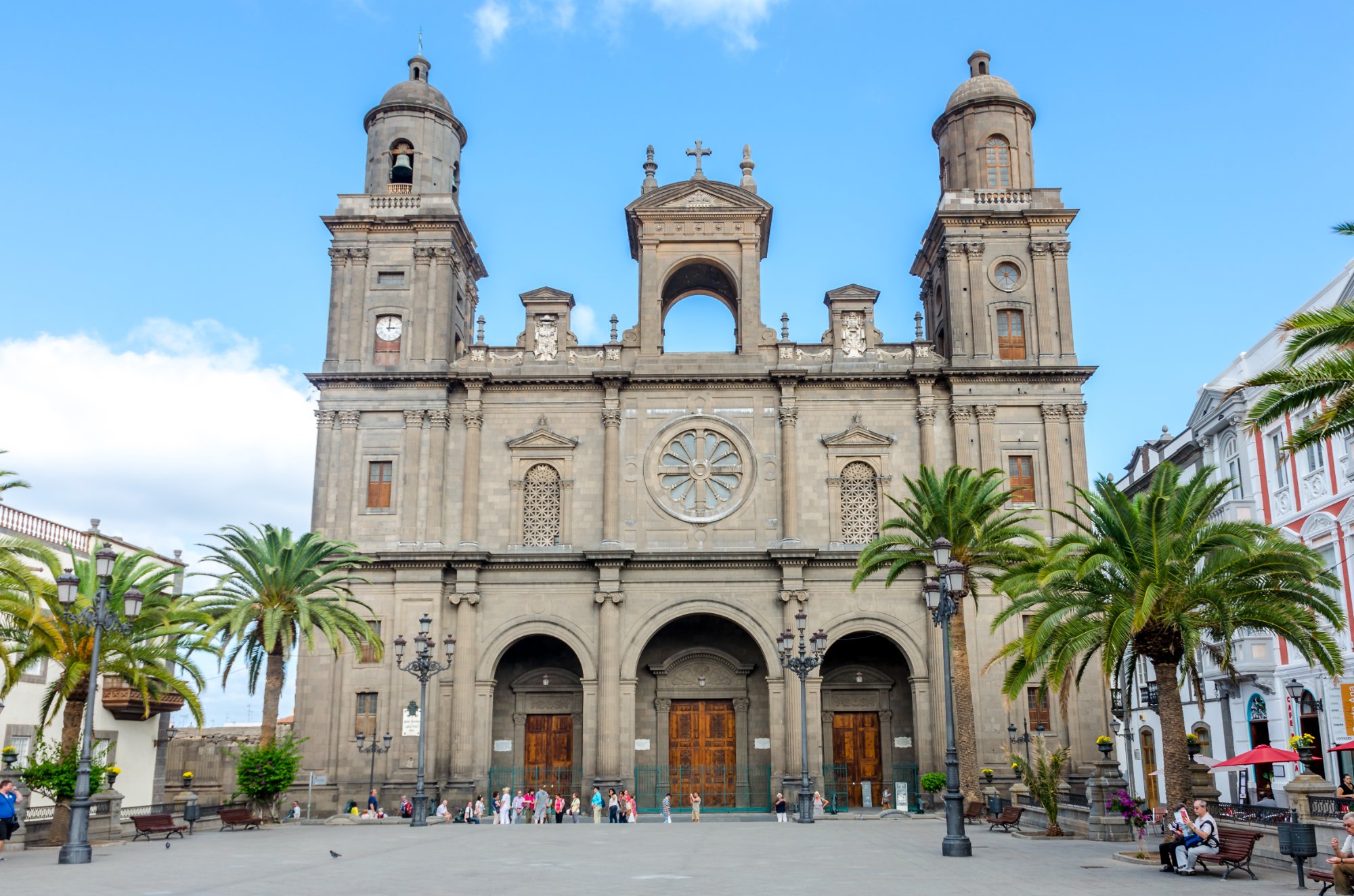 Santa Ana Cathedral facade with twin bell towers and palm trees in Vegueta, Las Palmas
